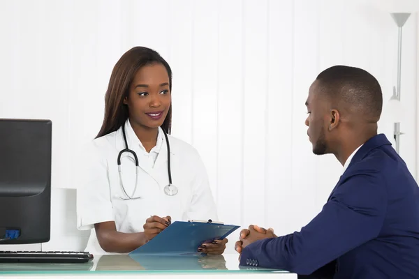 Female Doctor With Patient