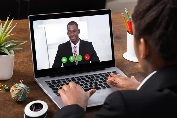 Businesswoman Video Conferencing On Laptop