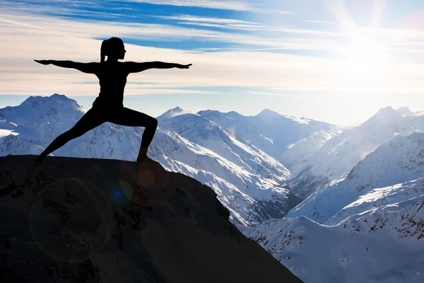 Woman Practicing Yoga On Cliff