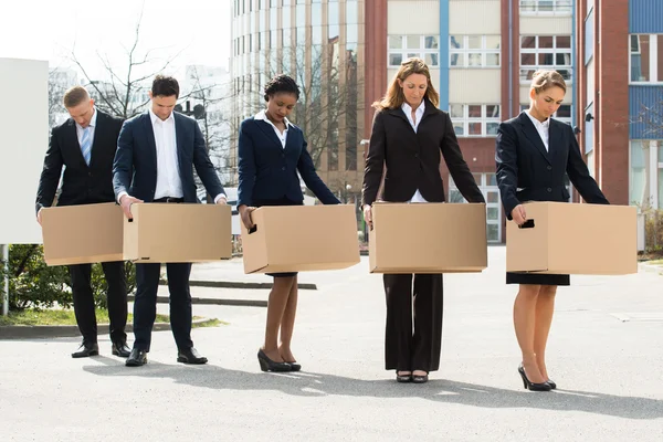 Unemployed Businesspeople With Cardboard Boxes