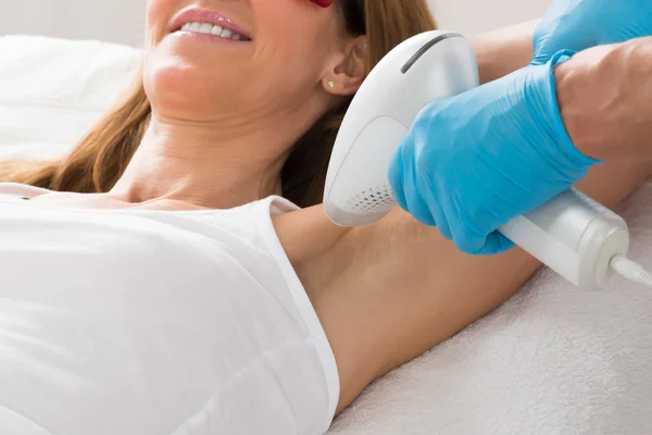 Woman Receiving Underarm Laser Hair Removal