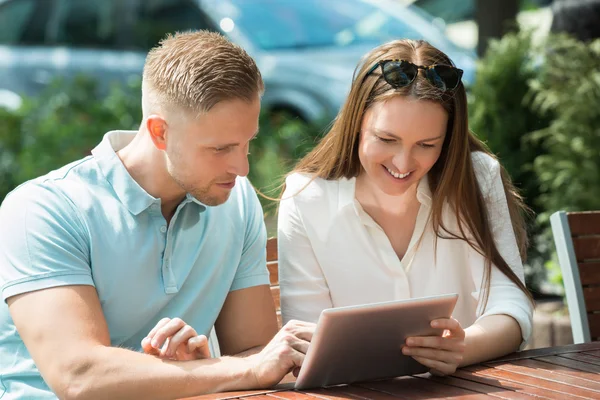 Couple Using Digital Tablet