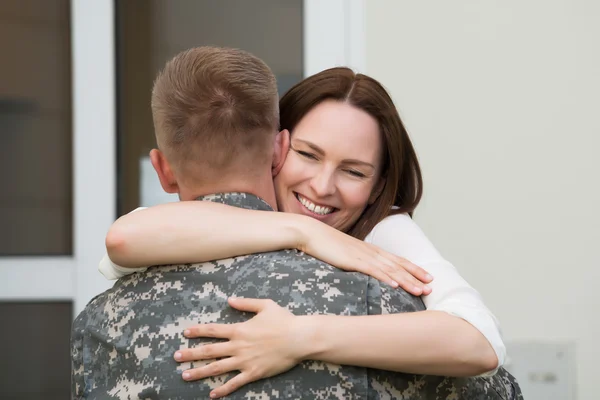 Happy Wife Hugging Her Husband