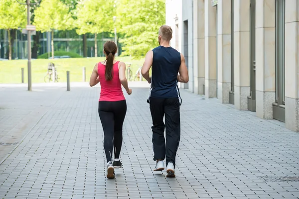 Young Couple Running Together