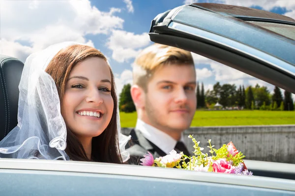 Young Just Married Couple In Car