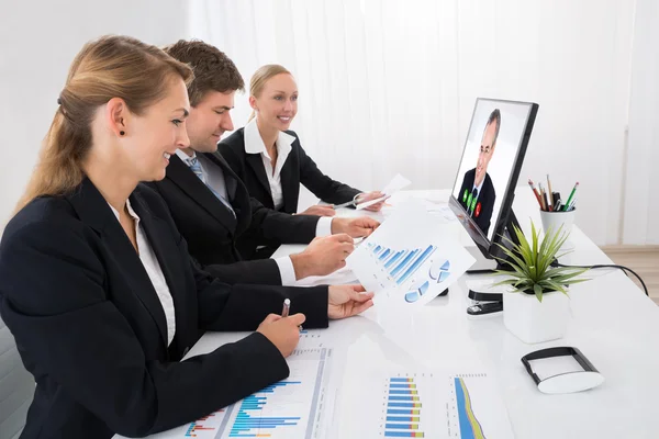 Businesspeople Video Conferencing On Computer