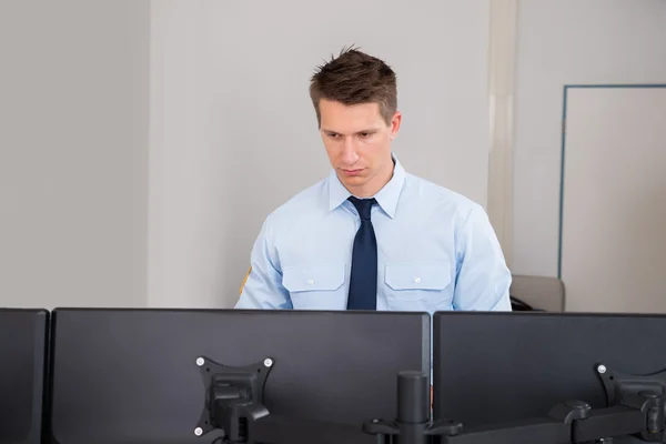 Security Guard Standing In Control Room