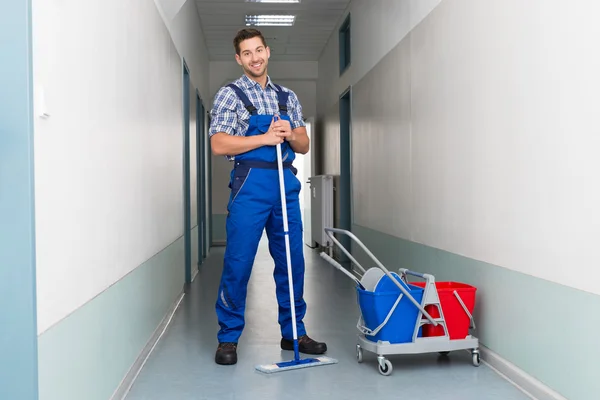 Male Worker With Broom