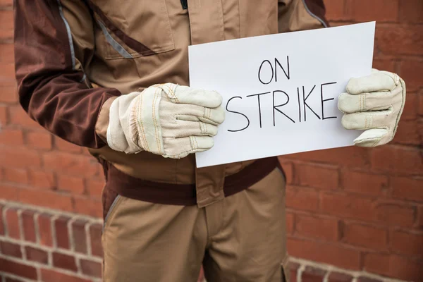 Worker Holding Placard