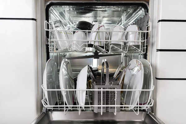 Utensils Arranged In Dishwasher