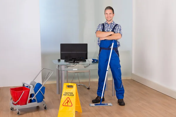 Male Janitor With Cleaning Equipments