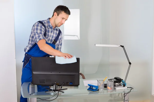 Janitor Cleaning Computer In Office