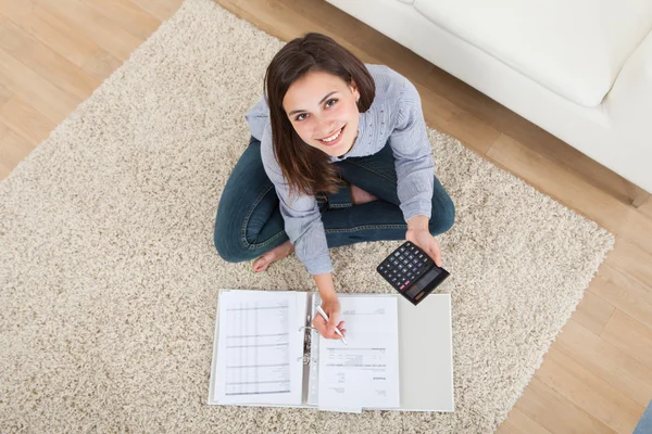 Woman Calculating Home Finances