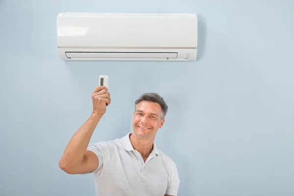 Man Using Air Conditioner