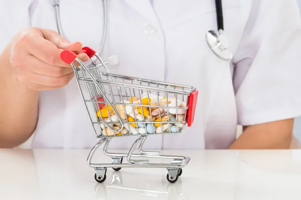 Doctor with Cart of Pills
