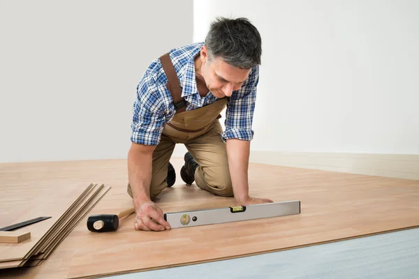 Man Installing New Laminated Floor