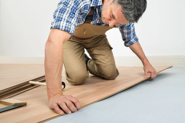 Man Installing Laminated Floor