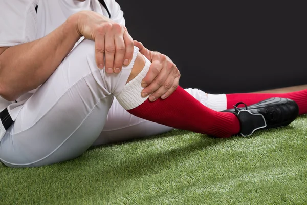 Football Player With Injury In Leg