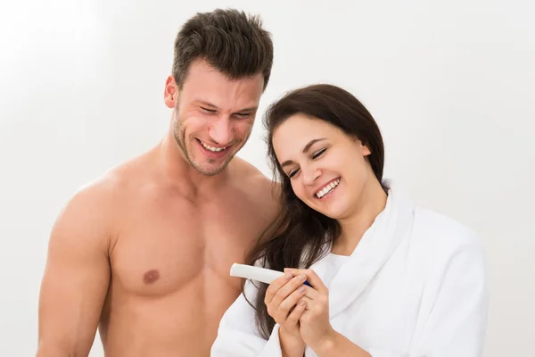 Couple with Result Of Pregnancy Test