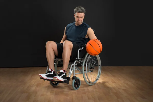 Disabled Basketball Player Throwing Ball