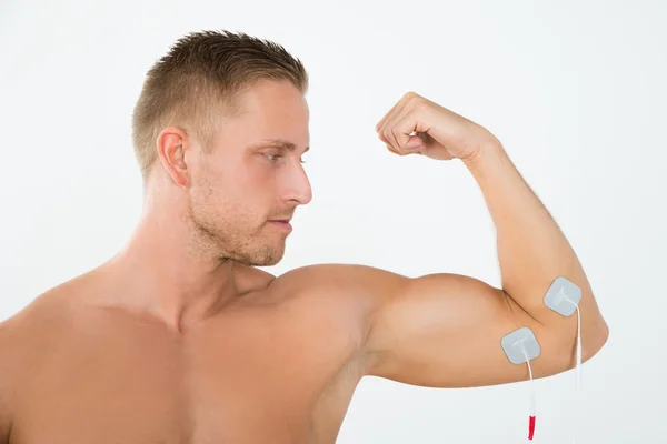 Man Having Electrotherapy Of Arm