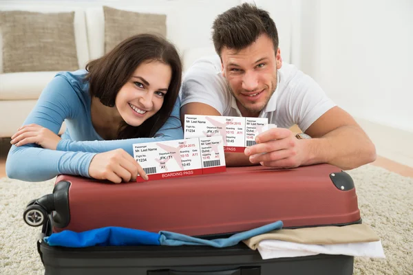 Happy Couple Showing Boarding Pass