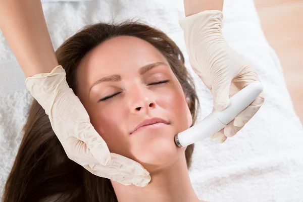 Woman Receiving Microdermabrasion Therapy