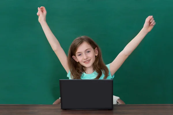 Happy Girl With Laptop In Classroom