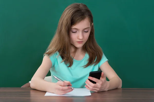 Girl With Mobile Phone And Books