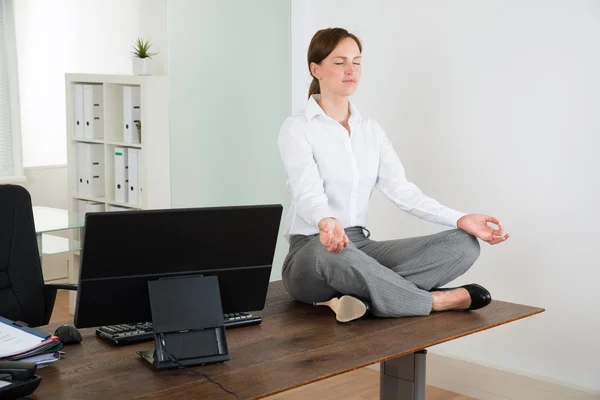 Businesswoman Doing Yoga