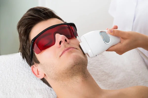 Man Receiving Laser Hair Removal Treatment