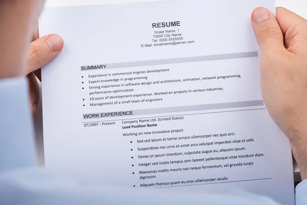 Businessperson Reading Resume