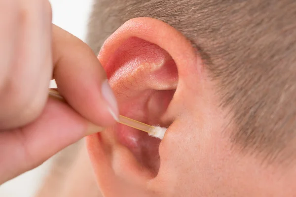 Man Cleaning His Ear