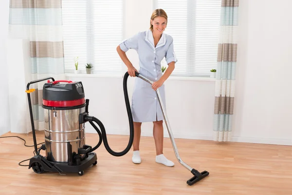 Female Maid With Vacuum Cleaner