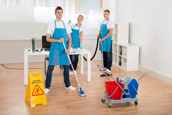 Cleaners Team Cleaning Floor
