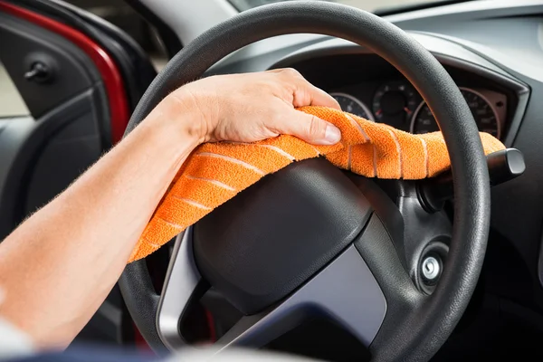 Worker Polishing Car Steering Wheel