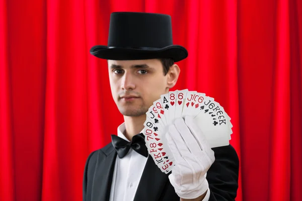 Magician Holding Fanned Out Cards