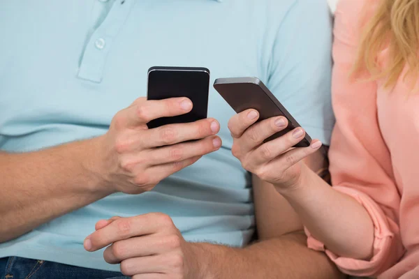 Couple Using Smart Phones