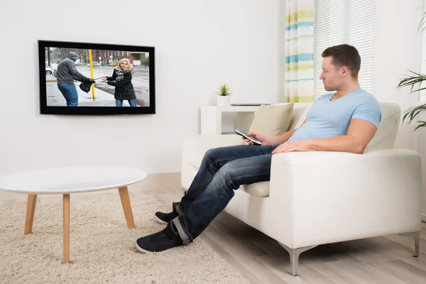 Man Watching Movie In Living Room