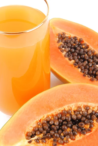 Papaya fruit and glass of juice isolated on white