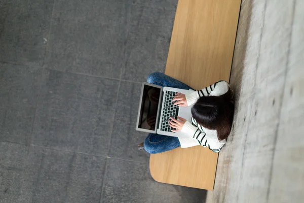 Woman typing on laptop computer