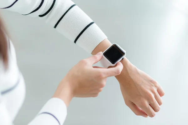 Woman using smart watch