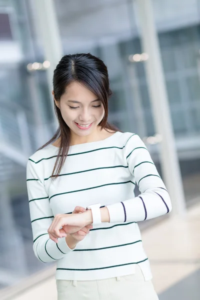 Asian woman using smart watch