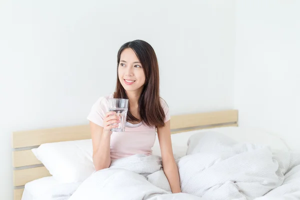 Woman drinking glass of water