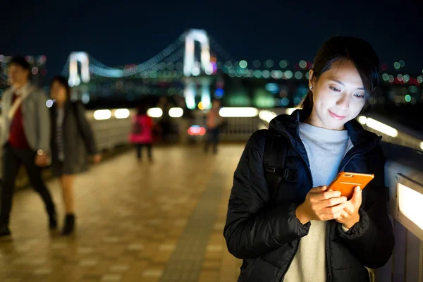 Woman sending text message on phone