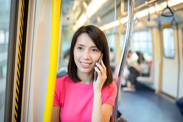 Asian young woman talking on cellphone