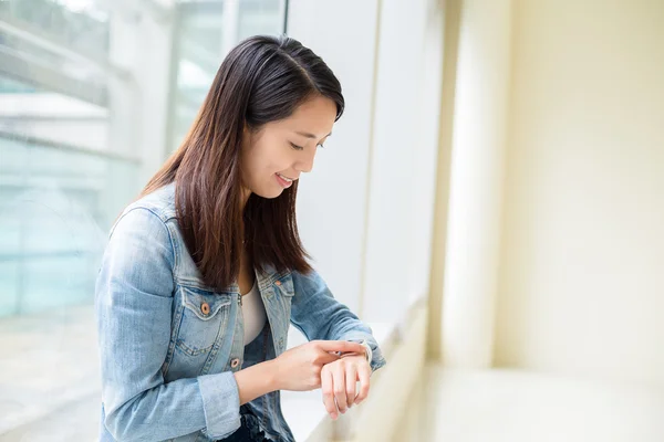 Woman using wearable smart watch