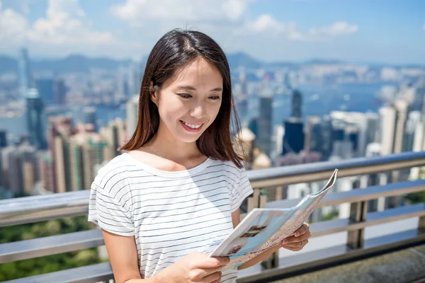 Woman using the city map in Hong Kong