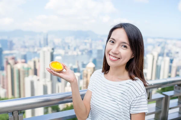 Woman holding famous Hong Kong food