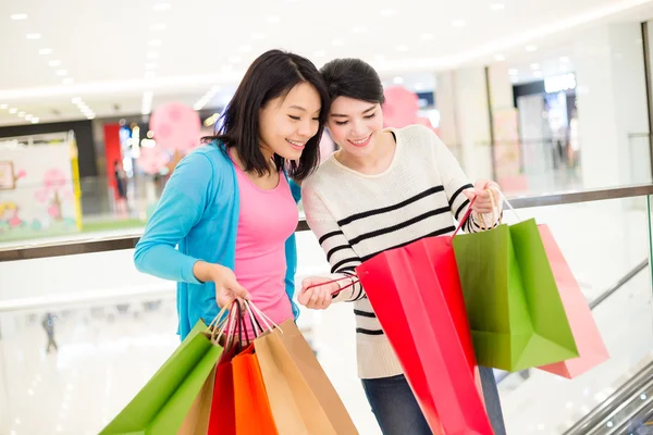 Women looking inside shopping bag